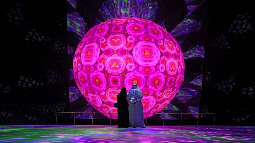 Visitors stand in front of a display at the Saudi Arabia Pavilion of Expo 2020, in Dubai on Oct. 4, 2021.