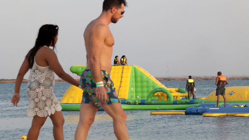 Beachgoers are seen at the floating water park at Pure Beach in King Abdullah Economic City, Saudi Arabia, Sept. 17, 2021.