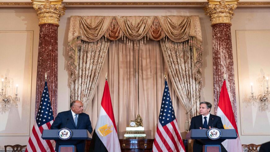 US Secretary of State Antony Blinken (R) listens as Egyptian Foreign Minister Sameh Shoukry speaks.