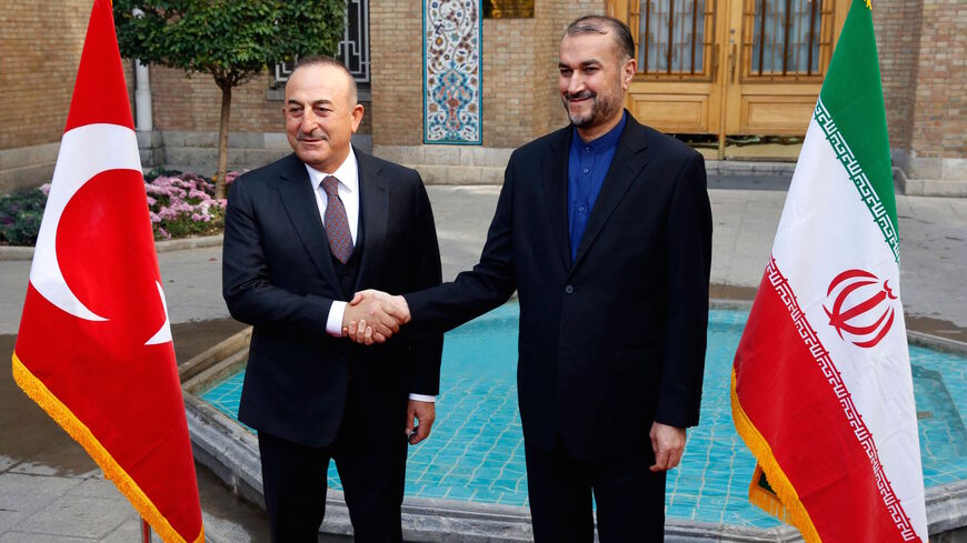 Iran's Foreign Minister Hossein Amir-Abdollahian (R) welcomes his Turkish counterpart Mevlut Cavusoglu (L) in the capital Tehran on November 15, 2021.