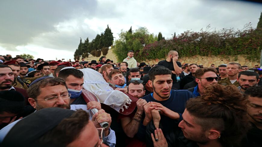Mourners carry the body of 25-year-old Eliyahu Kay during his funeral in Jerusalem on Nov. 22, 2021.