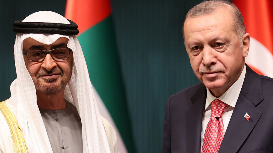 Turkish President Recep Tayyip Erdogan (R) and Abu Dhabi's Crown Prince Sheikh Mohammed bin Zayed Al Nahyan pose as they attend a signing ceremony regarding the agreements between the two countries at the Presidential Complex in Ankara, on Nov. 24, 2021.