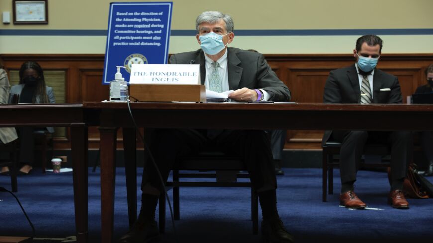 National Cyber Director Chris Inglis listens during a hearing with the House Committee on Oversight and Reform.