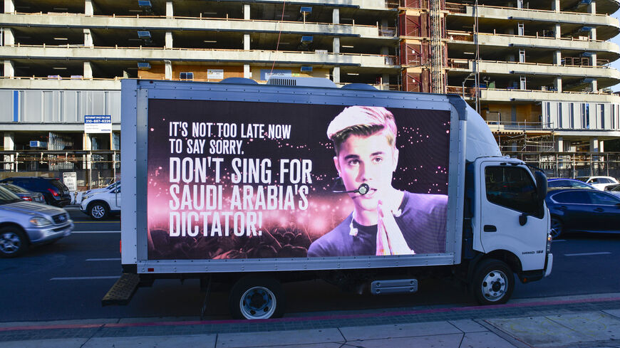 Mobile billboards urging Justin Bieber to cancel his upcoming concert in Saudi Arabia near the Microsoft Theater on Nov. 21, 2021 in Los Angeles, California.