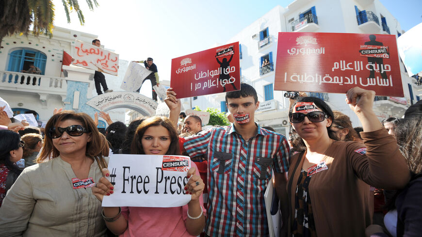 Tunisian journalists protest during a strike, after months of rising tensions with the Islamist-led government, which is accused of curbing press freedom and seeking to control public media groups, Tunis, Tunisia, Oct. 17, 2012.