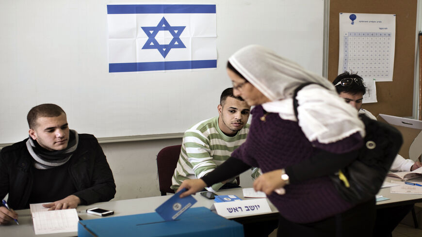 A Druze woman casts her ballot in the northern village of Maghar, Israel, Jan. 22, 2013.