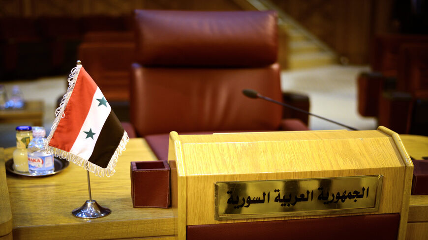 The empty seat of Syria is seen during an emergency representatives meeting to discuss the conflict in Libya, at the Arab League headquarters, Cairo, Egypt, Jan. 5, 2015.