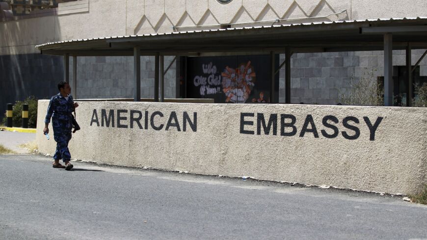 A Yemeni security guard walks past the compound of the US Embassy in the Yemeni capital, Sanaa, on Oct. 8, 2015.