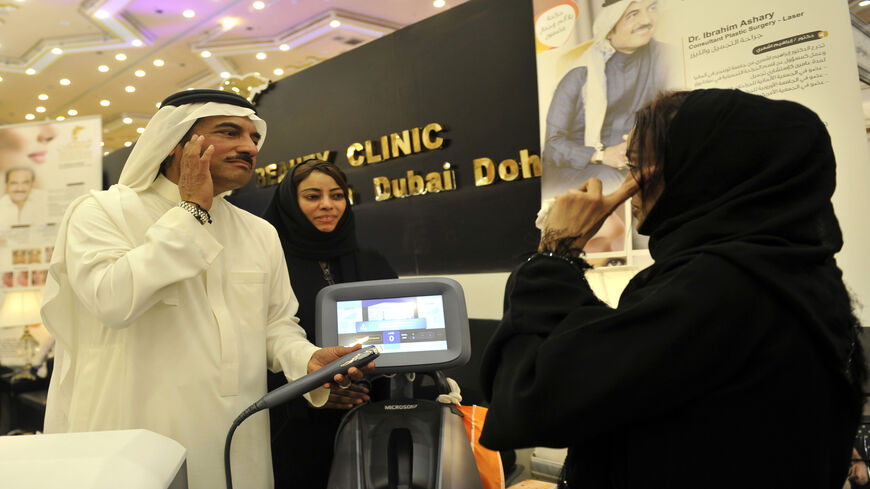 A Saudi woman consults a plastic surgeon during a bridal expo in the Red Sea city of Jeddah, Saudi Arabia, April 11, 2017.
