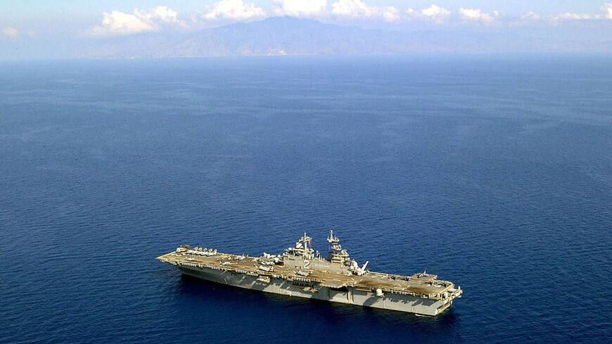 The amphibious assault ship USS Essex sails off the coast of Dili, East Timor, Oct. 31, 2001.