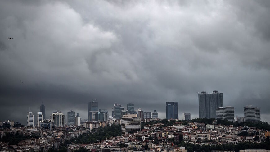 A picture taken in Istanbul on May 28, 2018 shows Maslak and Besiktas business districts under a stormy sky. 