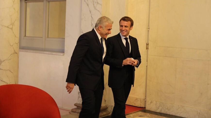 Foreign Minister Yair Lapid meets at the Elysee palace with French President Emmanuel Macron, Paris, Nov. 30 2021.