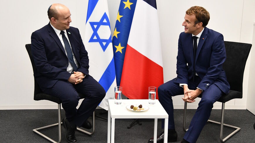 Israeli Prime Minister Naftali Bennett meets with French President Emmanuel Macron at the COP 26 Climate Summit in Glasgow, Nov. 1 2021.