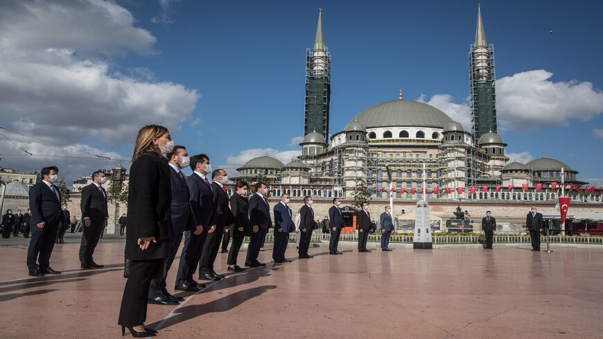 Istanbul Mayor Ekrem Imamoglu (6th-L) attends a ceremony at Taksim Square to mark the National Sovereignty and Children’s Day holiday on the first day of a four-day lockdown due to the coronavirus pandemic, Istanbul, Turkey, April 23, 2020.