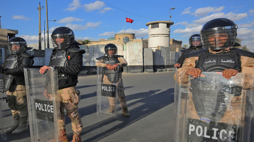 Iraqi riot police protect the Turkish Embassy in Baghdad after calls on social media to gather outside the embassy to protest Turkey's vows to invade the northwestern enclave of Sinjar, Iraq, Feb. 18, 2021.