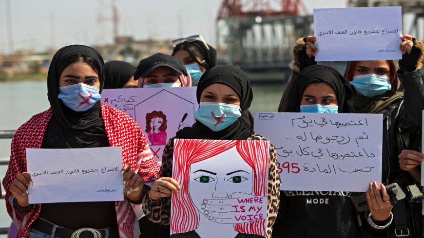 Demonstrators attend a rally for International Women's Day in Iraq's southern city of Basra on March 8, 2021.
