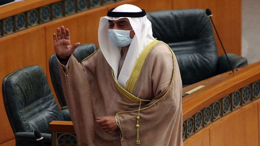 Kuwait's Prime Minister Sheikh Sabah Al-Khalid Al-Sabah waves upon his arrival to a parliamentary session at the National Assembly in Kuwait City on March 30, 2021.
