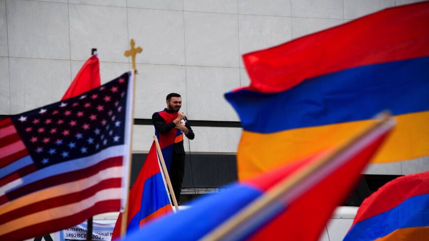 Armenian singer Andre Hovnanyan performs outside of the Turkish Consulate on the anniversary of the Armenian Genocide, April 24, 2021, in Beverly Hills, California.
