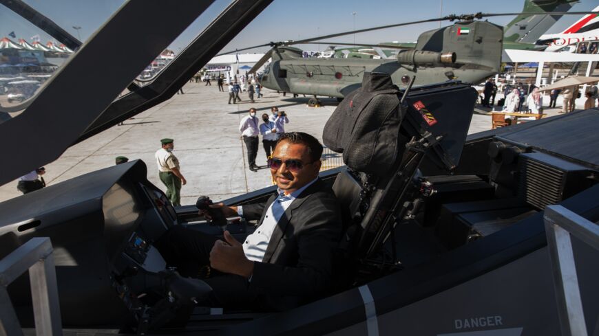 A tourist from India poses for photos in an F-35 Lighting II on display by Lockheed Martin at the Dubai Airshow 2021 on Nov. 14, 2021