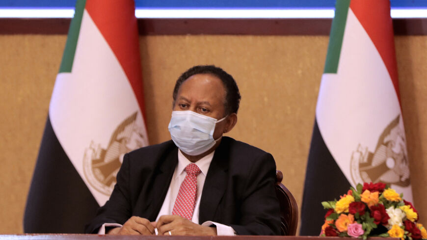 Sudan's Prime Minister Abdalla Hamdok looks on during a deal-signing ceremony with top general Abdel Fattah al-Burhan (unseen) to restore the transition to civilian rule in the country in the capital Khartoum, on Nov. 21, 2021. 