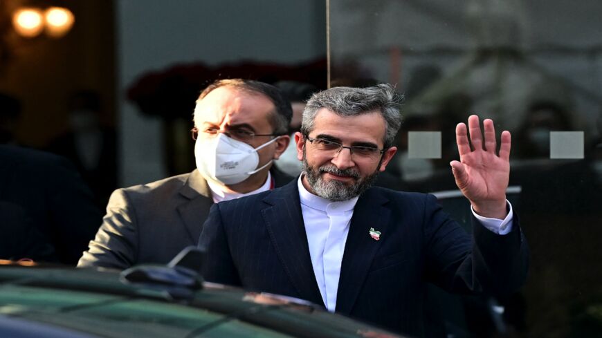 Iran's chief nuclear negotiator, Ali Bagheri Kani (R), and members of his delegation are seen leaving the Coburg Palais in Vienna on Dec. 3, 2021.