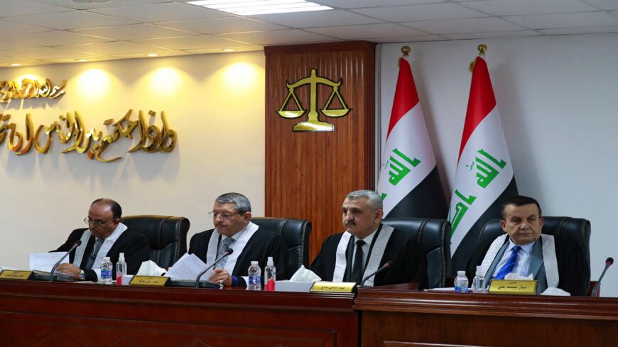 Iraqi judges attend a court session at the Supreme Judicial Council in the Iraqi capital, Baghdad, on Dec. 27, 2021.