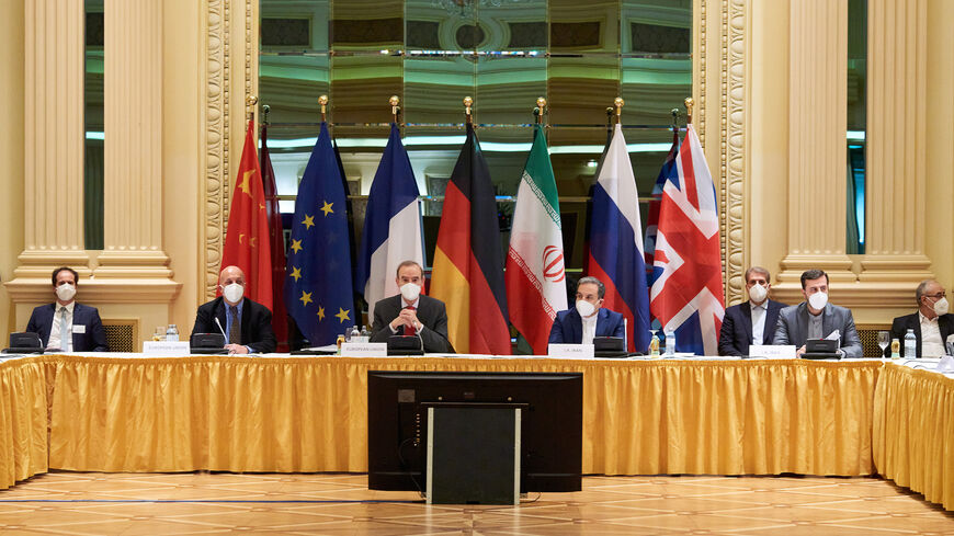 In this handout provided by the EU Delegation in Vienna, Representatives of the European Union (L) and Iran (R) attend the Iran nuclear talks at the Grand Hotel on April 06, 2021 in Vienna, Austria.