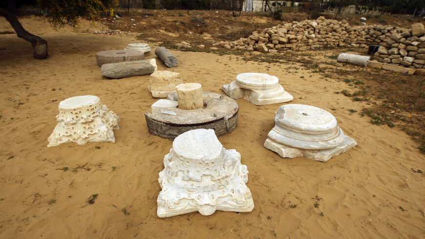 Capitals (L) and two plinths (R) are seen in the sand at the archaeological site of the St. Hilarion Monastery, in Tell Umm al-Amr, central Gaza Strip, March 19, 2013.
