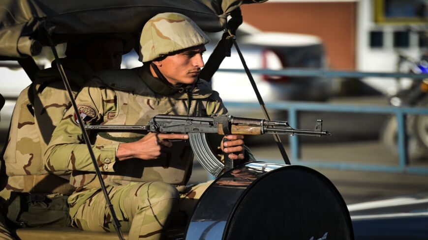 An Egyptian member of the armed forces patrols outside al-Maza military airport on Jan. 30, 2015, in the capital, Cairo. 