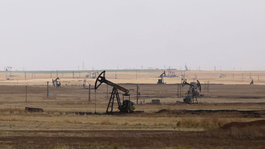 Oil well pumps are seen in the Rmeilane oil field in Hasakah province, Syria, July 15, 2015.
