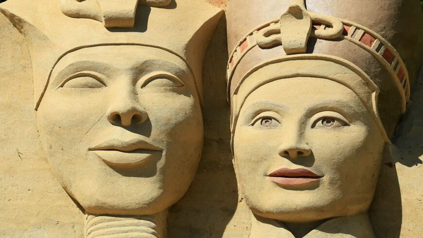 Sand statues of Egyptian King Akhenaten and Nefertiti are pictured on May 29, 2017, in Lednice, south Moravia.