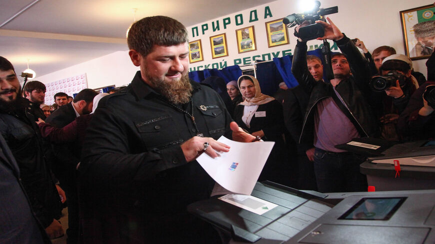 Chechnya's leader Ramzan Kadyrov casts his ballot as he votes during Russia's presidential election at a polling station in the settlement of Tsentoroy, outside Grozny, March 18, 2018.