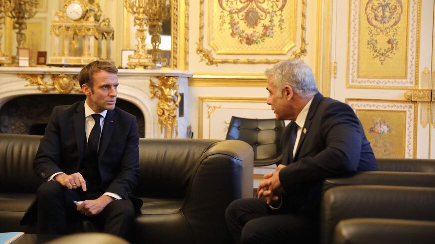 Israeli Foreign Minister Yair Lapid meets with French President Emmanuel Macron in Paris, Nov. 30, 2021.