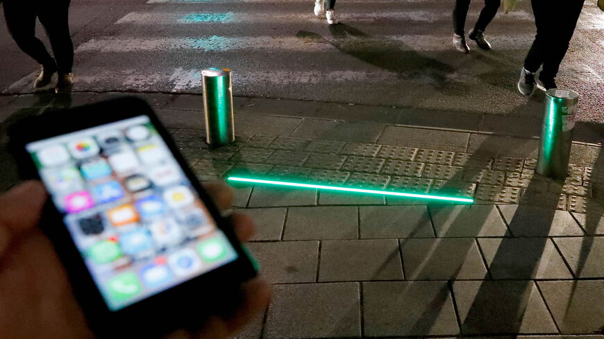 LED ground level lights installed to warn texting pedestrians before crossing the road are seen in the coastal city of Tel Aviv, Israel, March 12, 2019.