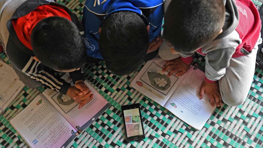 Syrian students study via WhatsApp