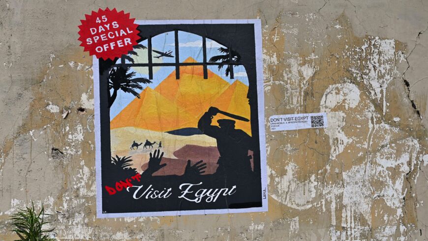 A poster by Italian street artist Laika entitled "Don't visit Egypt" is pictured on a wall near the Egyptian Embassy on June 16, 2021.