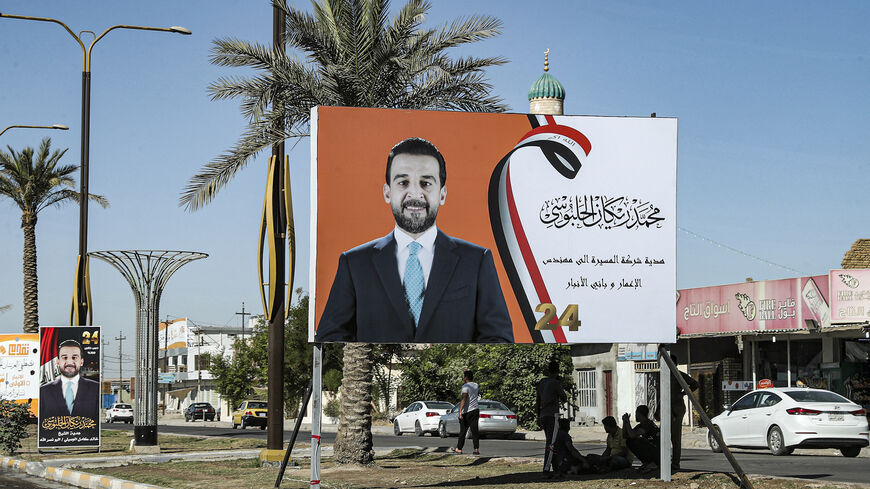 This picture taken on Sept. 26, 2021 shows an electoral campaign billboard ahead of Iraq's early legislative elections, depicting current parliament speaker Mohamed al-Halbousi, along the side of a road in the city of Ramadi, the capital of Iraq's central Anbar Governorate.