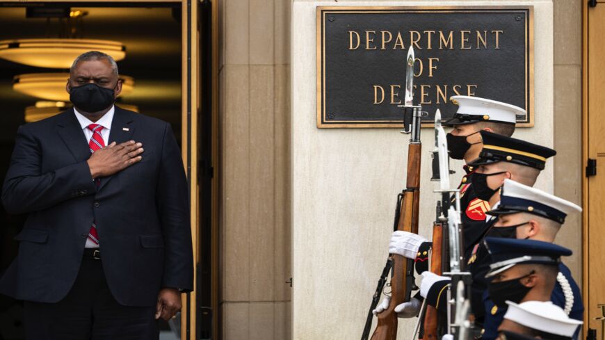 US Secretary of Defense Lloyd Austin stands for the national anthem at the Pentagon on Oct. 6, 2021, in Arlington, Virginia.