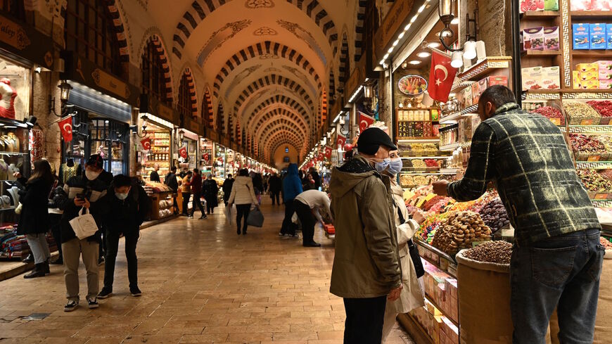 Tourists shop inside spice bazaar at Eminonu district in Istanbul on Dec. 16, 2021.