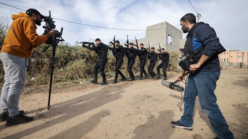 Palestinian actors and crew shoot a scene of the series by local Al-Aqsa TV "Qabdat al-Ahrar," meaning "Fist of the Free" in Arabic, in Gaza city on Dec. 6, 2021. 