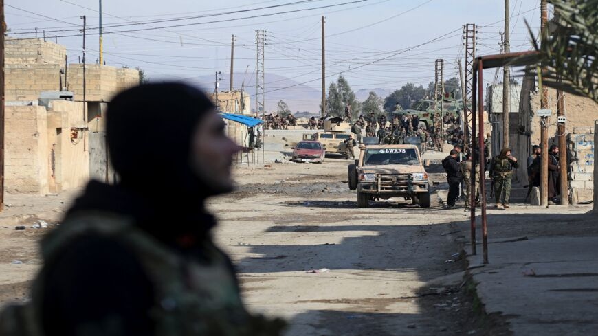 Kurdish security forces in Syria's Hasakah on Jan. 22, 2022, amid ongoing fighting with the Islamic State.