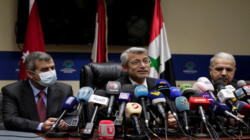 Lebanon's Energy Minister Walid Fayad (C) during the signing of a deal that will supply Lebanon with electricity, in Beirut on Jan. 26, 2022.
