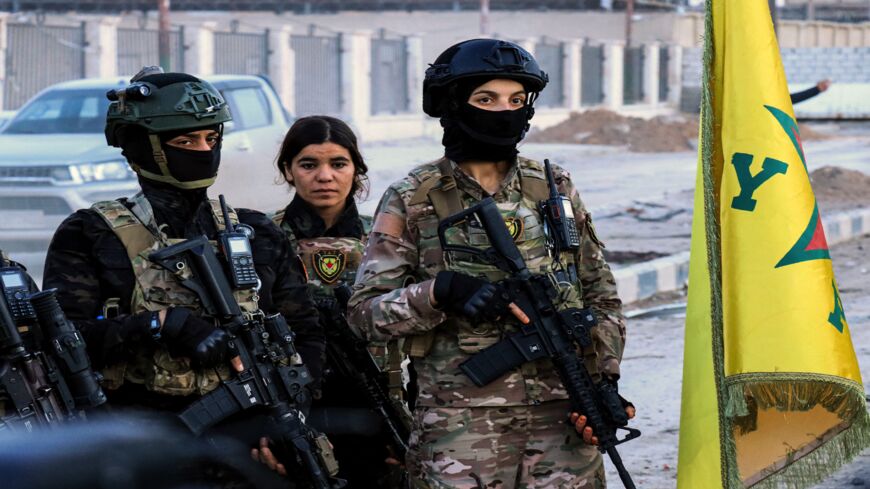 Female members of the Syrian Democratic Forces deploy outside Ghwayran prison in Syria's northeastern city of Hasakeh on January 26, 2022.