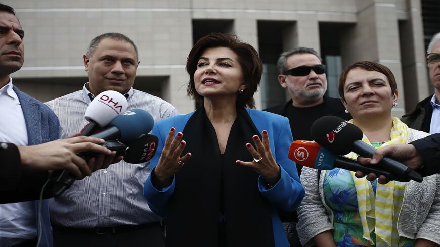 Turkish broadcast journalist Sedef Kabas (C), speaks to media members after her trial on Oct. 6, 2015, in Istanbul. 