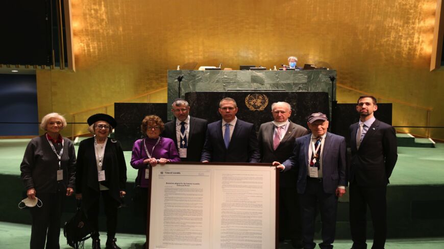 Israel's UN Envoy Gilad Erdan together with Holocaust survivors, after the UN General Assembly adopted an Israel-sponsored resolution against Holocaust denial, New York, Jan. 20, 2022.
