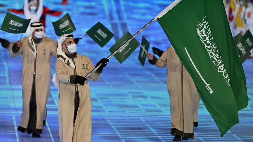 Fayik Abdi, carried the flag for Saudi Arabia in the Beijing Winter Olympics opening ceremony, is a rare elite skier from the Gulf kingdom