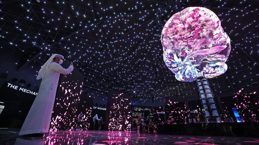 A visitor takes pictures inside the Russian Pavilion of Expo 2020, in Dubai on October 5, 2021