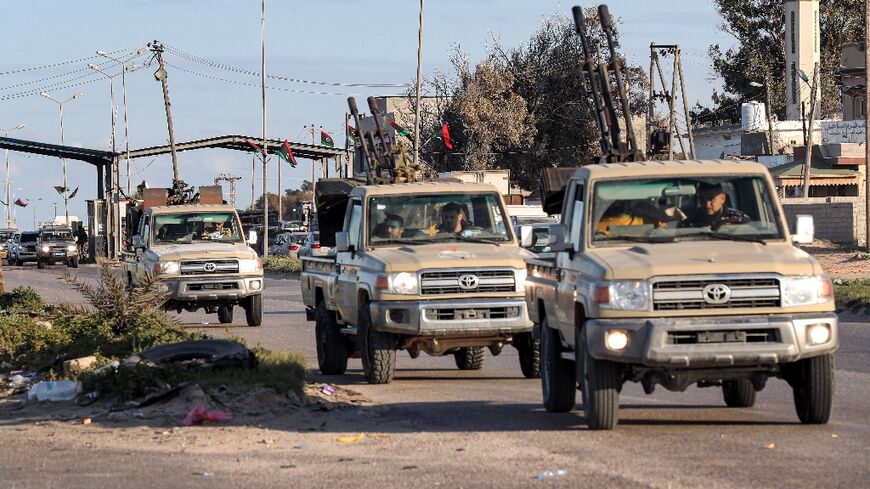 Vehicles of military brigades loyal to the Libyan unity government headed by Abdulhamid Dbeibah arrive from neighbouring towns to the capital Tripoli