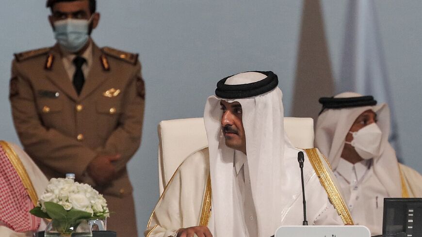 Qatar's emir, Sheikh Tamim bin Hamad Al-Thani (C), hosts a summit of the Gas Exporting Countries Forum dominated by the Ukraine showdown