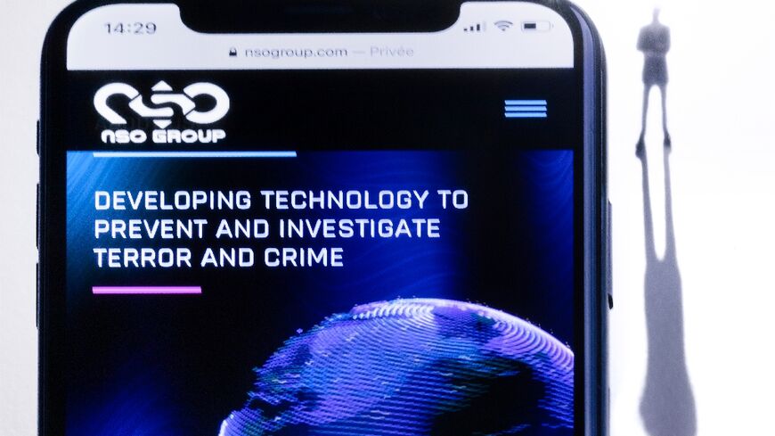 A smartphone with the website of Israel's NSO Group which features the Pegasus spyware